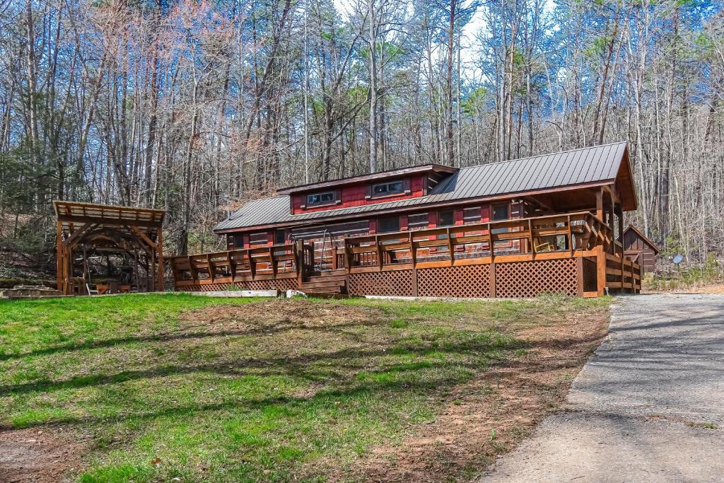 a large wooden house in the middle of a field at Just Chillin' in Blue Ridge