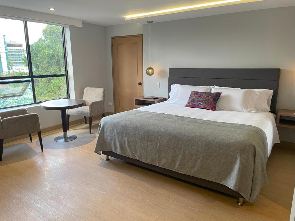 Postel nebo postele na pokoji v ubytování Hotel Parque 97 Suites