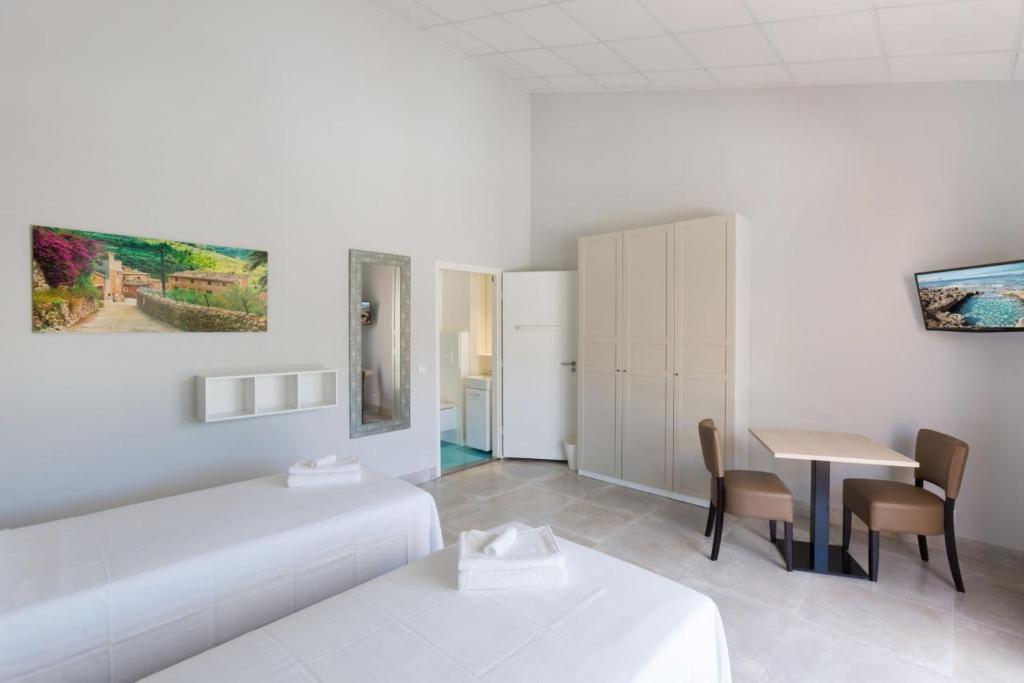 Postel nebo postele na pokoji v ubytování Hotel Fortuny javea