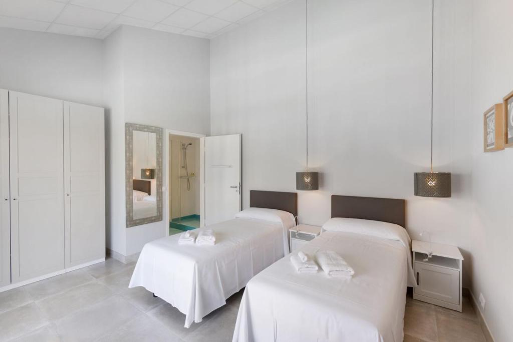 Postel nebo postele na pokoji v ubytování Hotel Fortuny javea