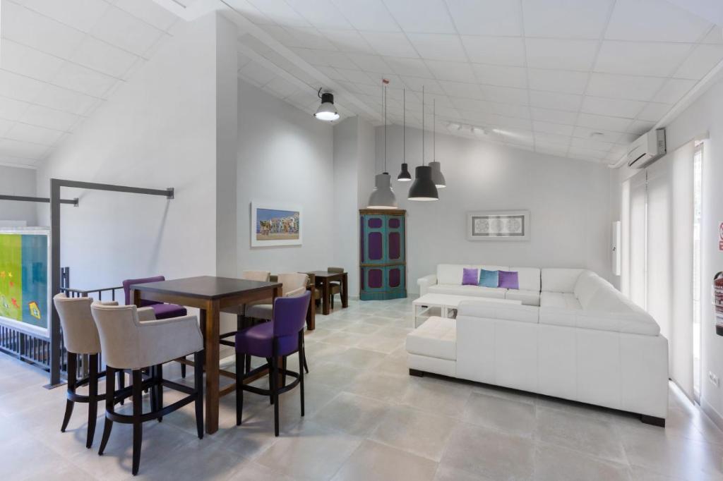 Postel nebo postele na pokoji v ubytování Hotel Fortuny javea