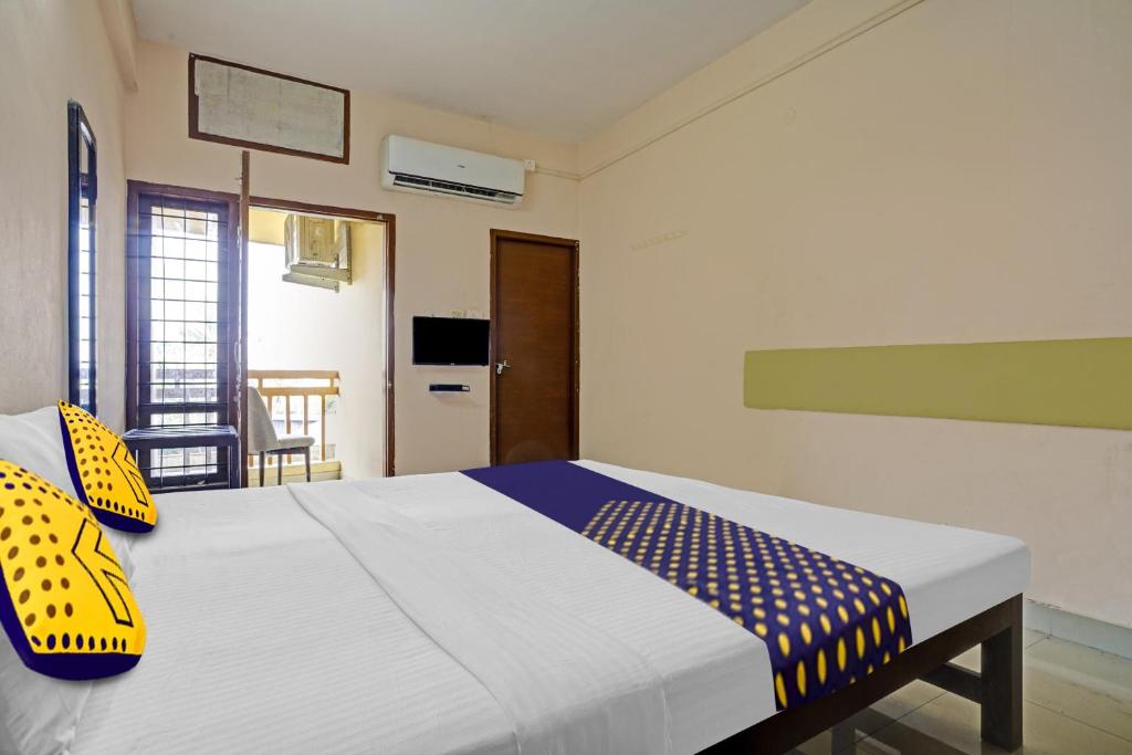 Ένα ή περισσότερα κρεβάτια σε δωμάτιο στο SPOT ON Bright Homes