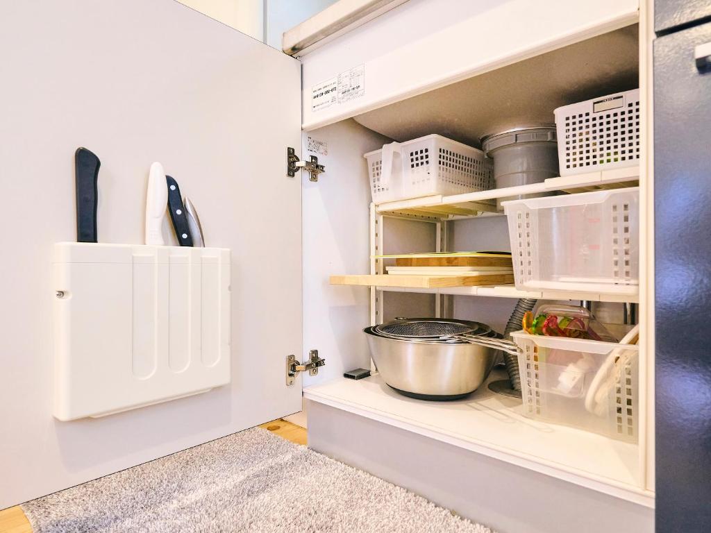 Kuchyň nebo kuchyňský kout v ubytování Kokoyui Guesthouse Shingu