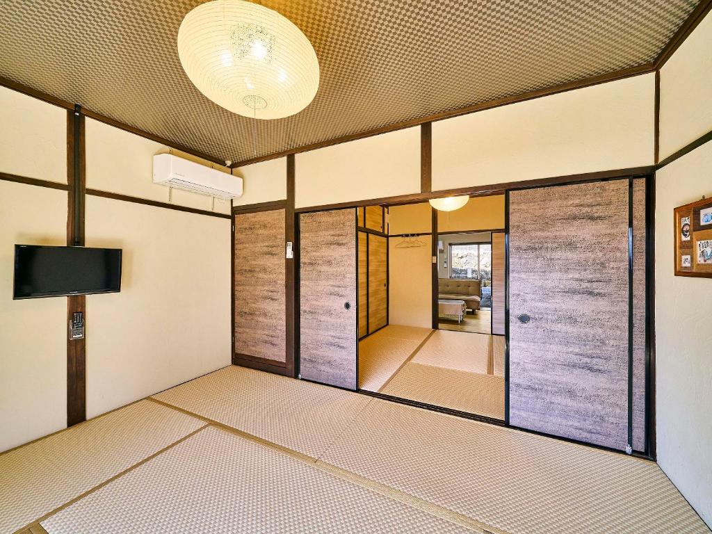 Postel nebo postele na pokoji v ubytování Kokoyui Guesthouse Shingu