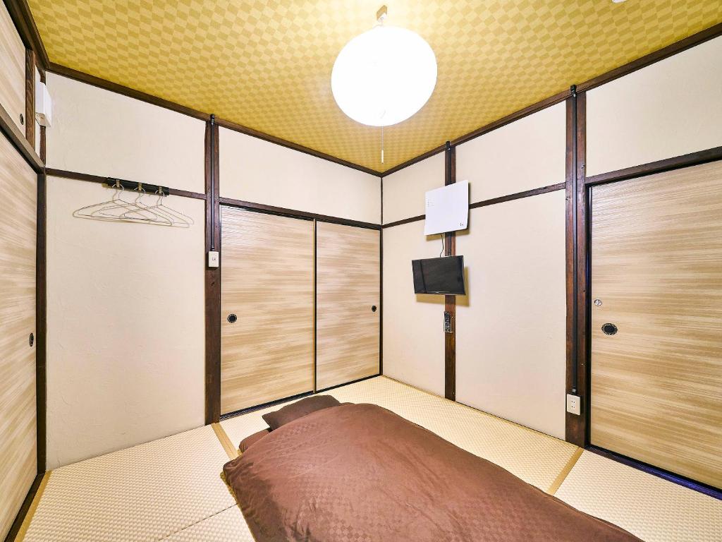 Postel nebo postele na pokoji v ubytování Kokoyui Guesthouse Shingu