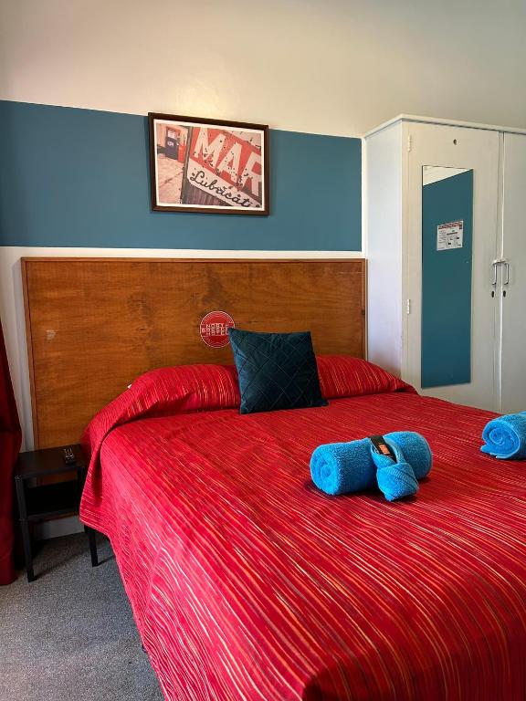 Postel nebo postele na pokoji v ubytování North Gregory Hotel