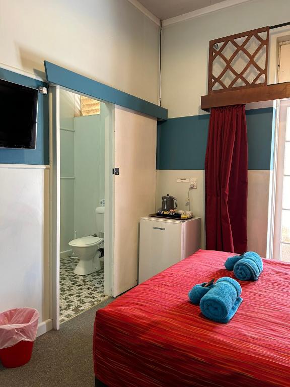 Postel nebo postele na pokoji v ubytování North Gregory Hotel