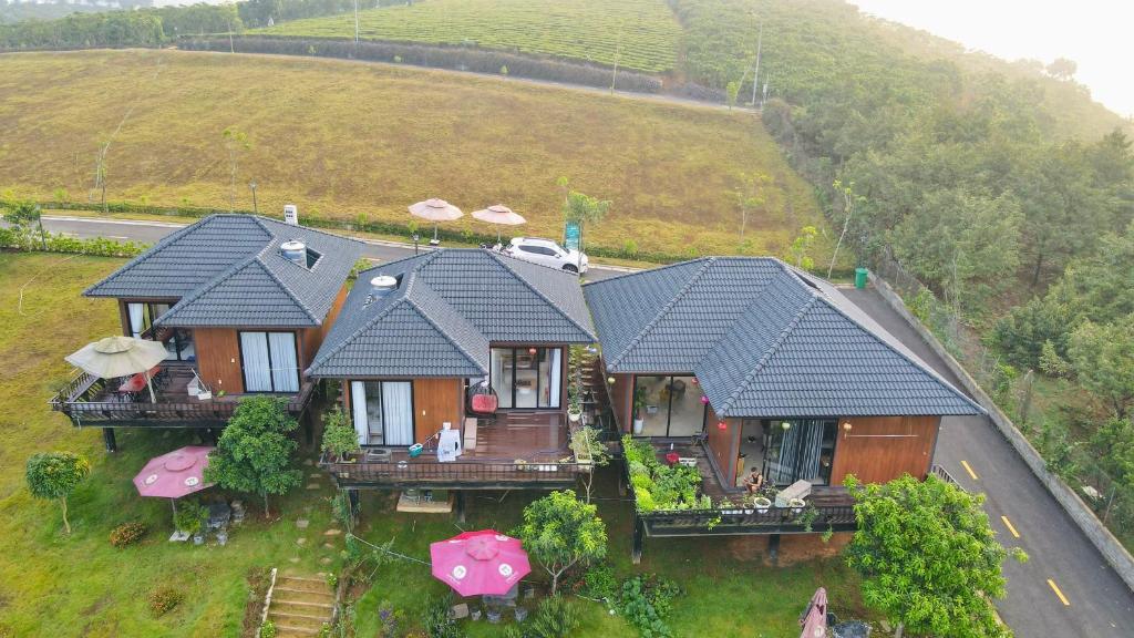 an aerial view of a house on a hill at Ogimi Villas Bảo Lộc in Blao Srê