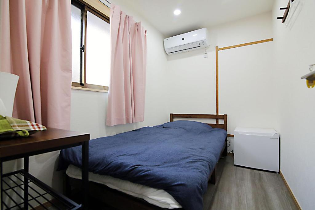 Postel nebo postele na pokoji v ubytování TOKYO MY HOME