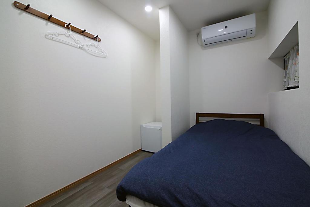 Postel nebo postele na pokoji v ubytování TOKYO MY HOME