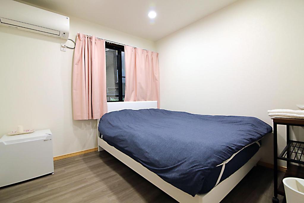 Postel nebo postele na pokoji v ubytování TOKYO MY HOME