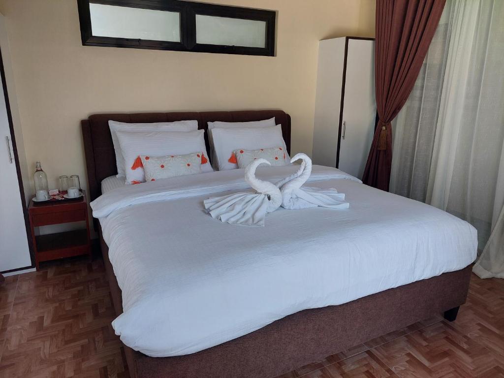 Postel nebo postele na pokoji v ubytování MaClare Resort