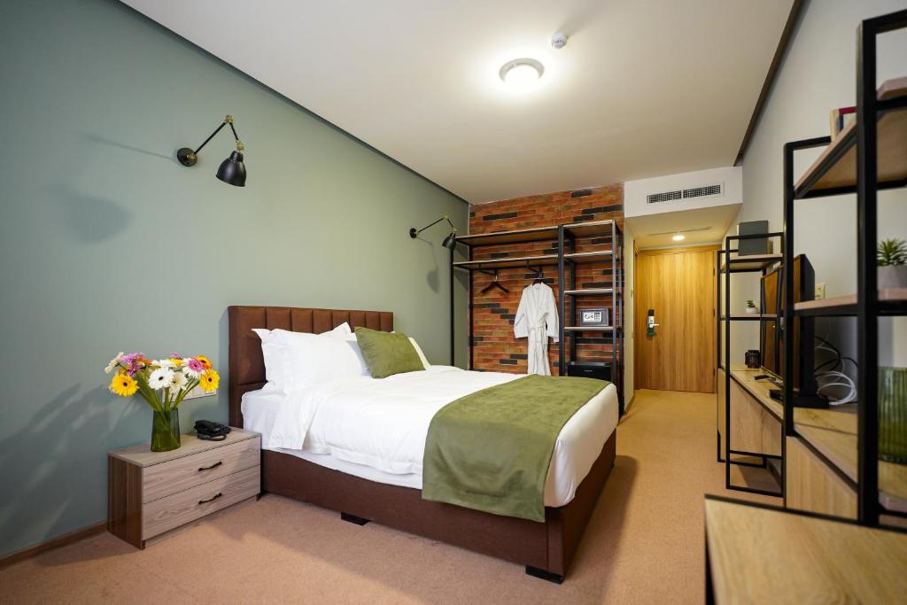 Postel nebo postele na pokoji v ubytování Felinger Collection Hotel & SPA