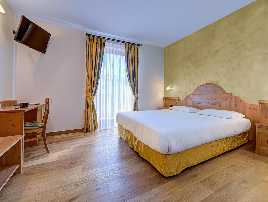 Postel nebo postele na pokoji v ubytování Hotel Garni La Vigna - Adult Friendly