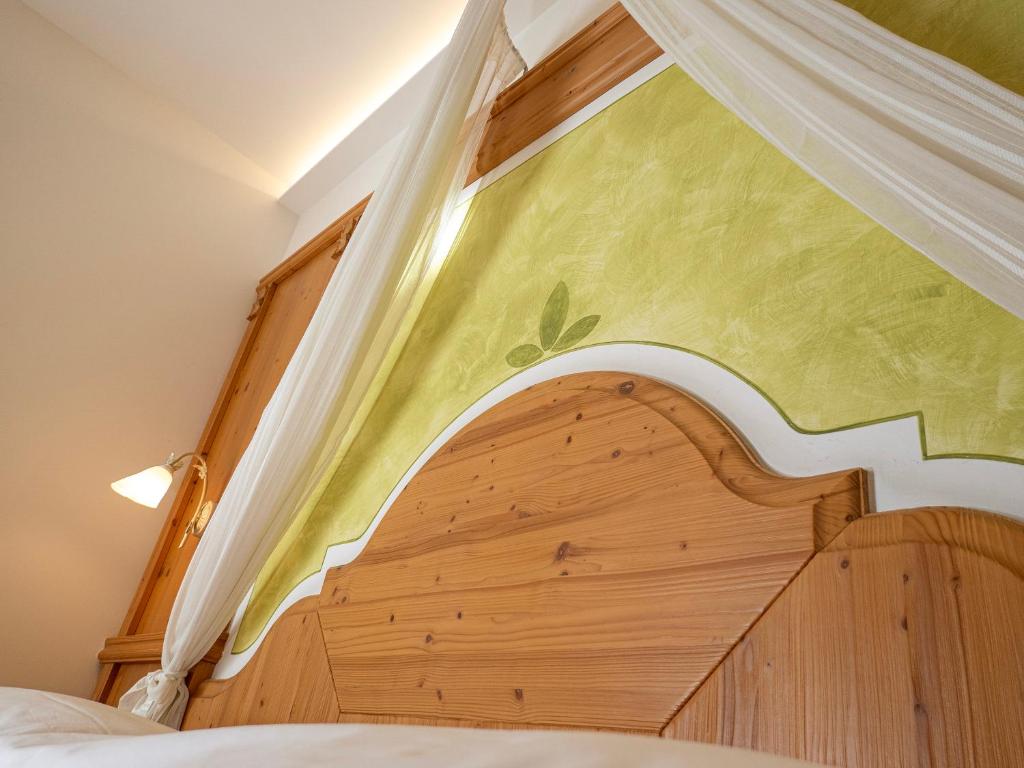 Postel nebo postele na pokoji v ubytování Hotel Garni La Vigna - Adult Friendly