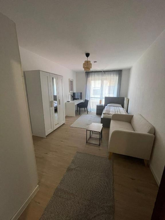 a living room with a couch and a table at Wegener Apartments in Mannheim