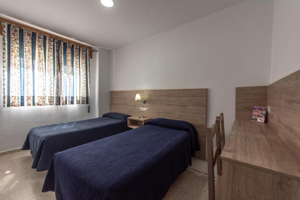 Posteľ alebo postele v izbe v ubytovaní Hotel San Andres