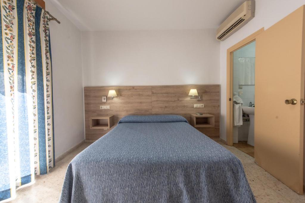 Posteľ alebo postele v izbe v ubytovaní Hotel San Andres