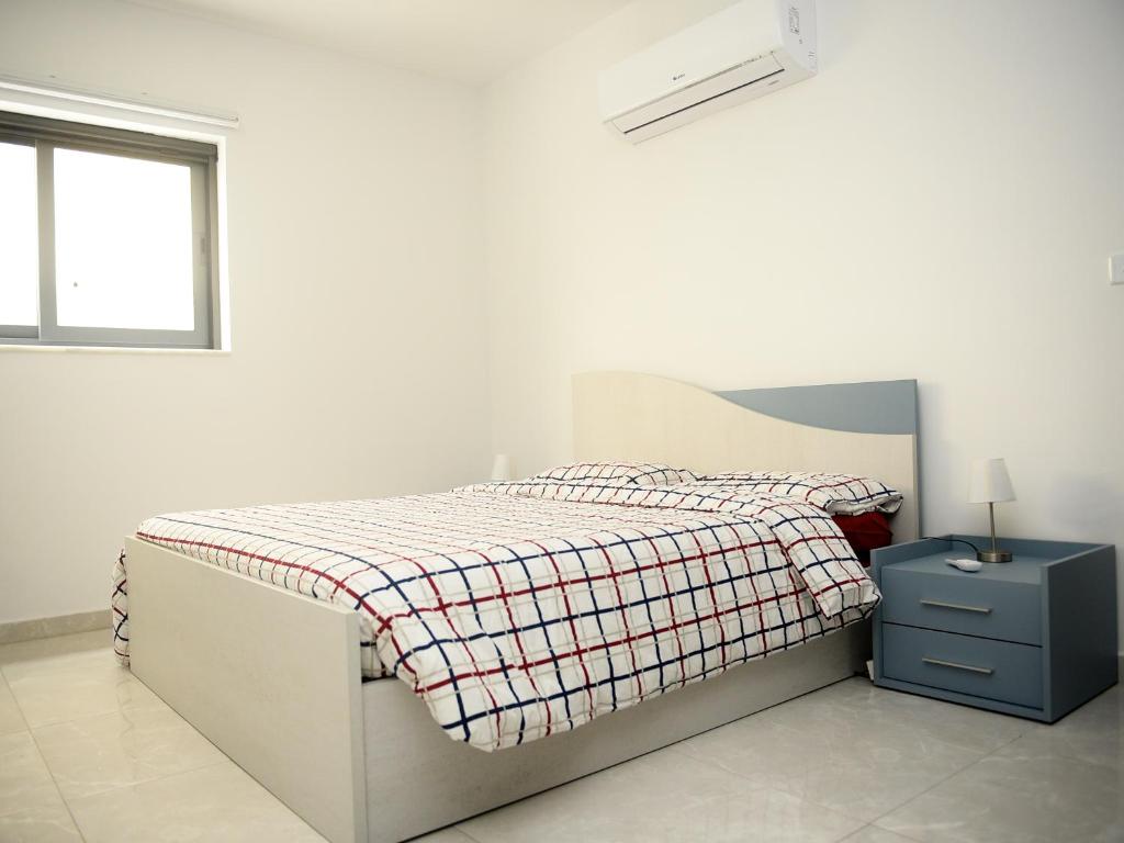 Кровать или кровати в номере Seaview-CasadiAlfio-Qawra