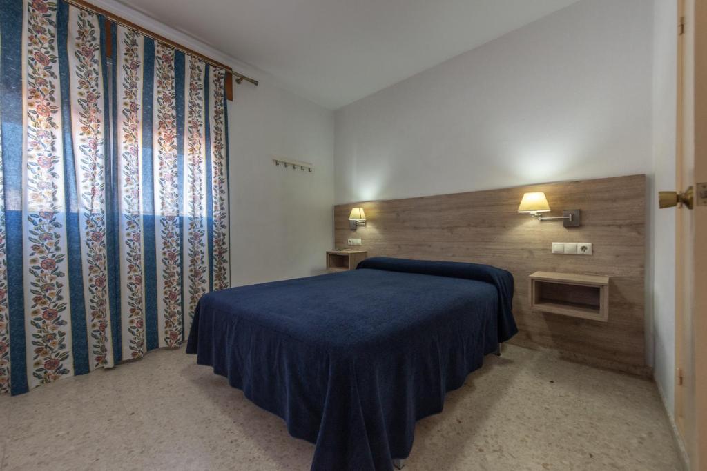 Posteľ alebo postele v izbe v ubytovaní Hotel San Andres