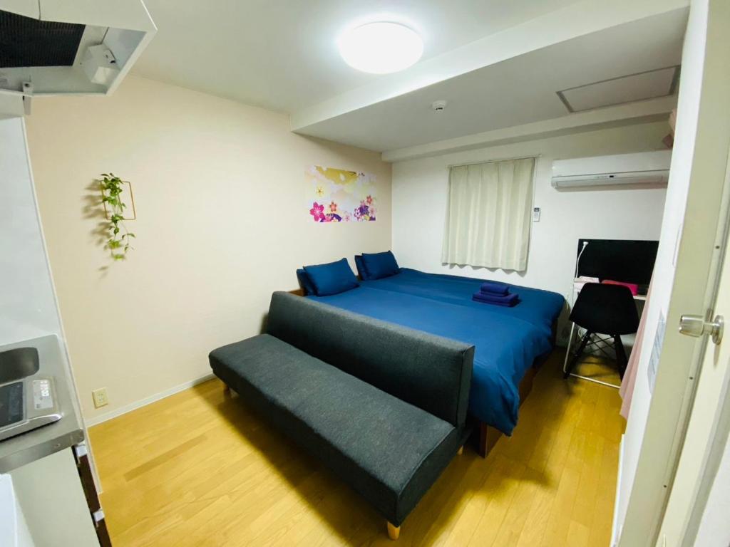 Кровать или кровати в номере Miyabiro 102