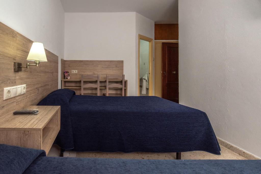 Posteľ alebo postele v izbe v ubytovaní Hotel San Andres