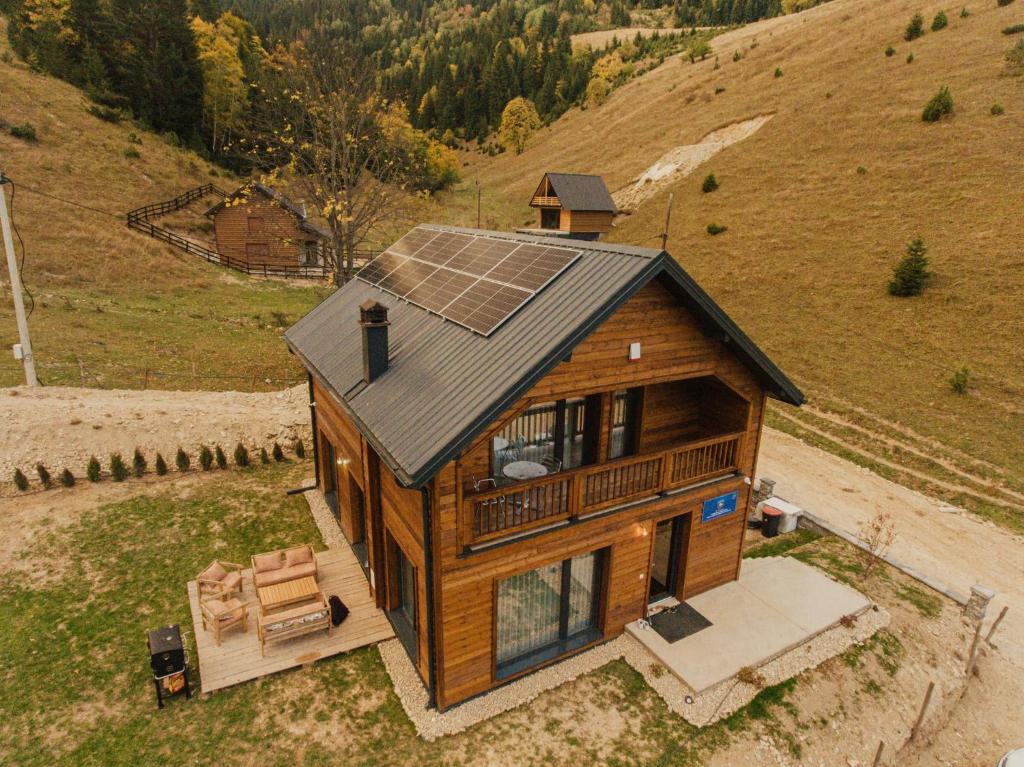 an overhead view of a house with a solar roof at Bujtina e Gjyshes in Peje