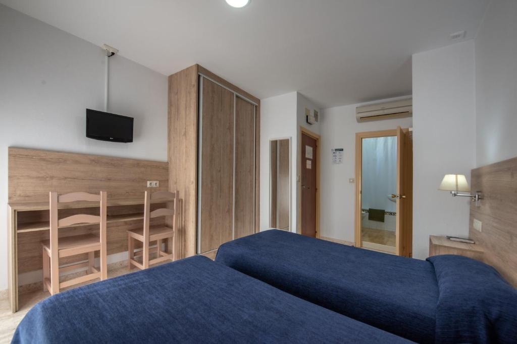 Posteľ alebo postele v izbe v ubytovaní Hotel San Andres