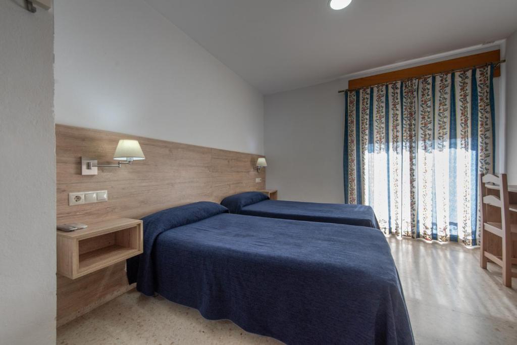 Posteľ alebo postele v izbe v ubytovaní Hotel San Andres