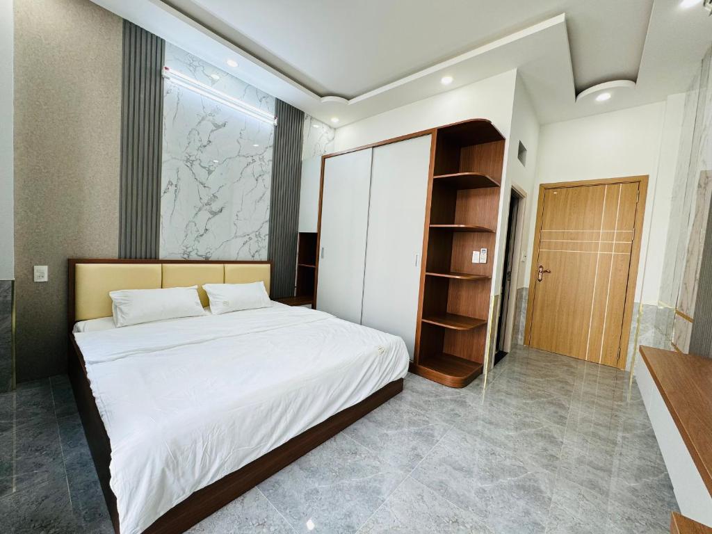 Postel nebo postele na pokoji v ubytování TONY HOMESTAY CẦN THƠ