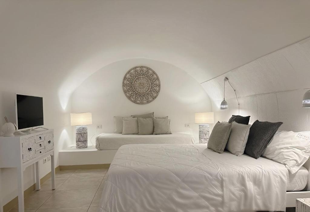 Llit o llits en una habitació de Palmieri Luxury Rooms