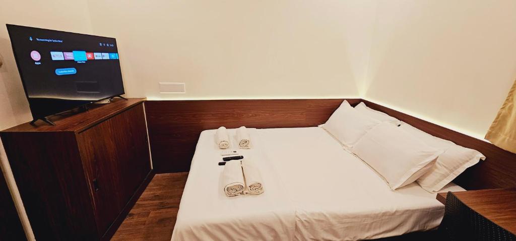 Postel nebo postele na pokoji v ubytování Chippy Inn
