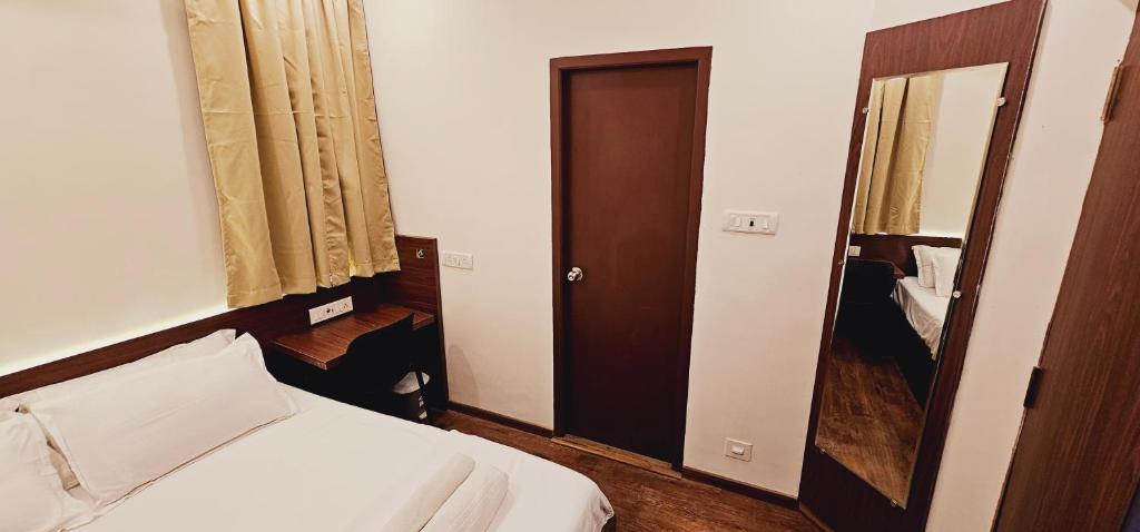 Postel nebo postele na pokoji v ubytování Chippy Inn