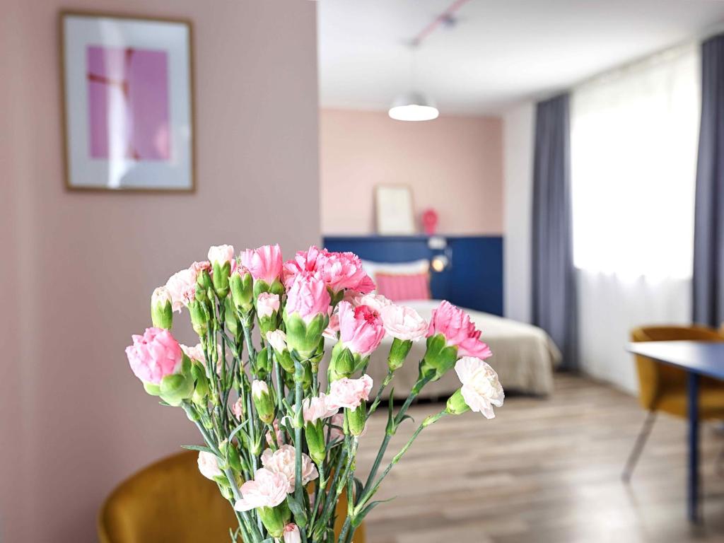 Postel nebo postele na pokoji v ubytování Max Aparthotel in Fürth