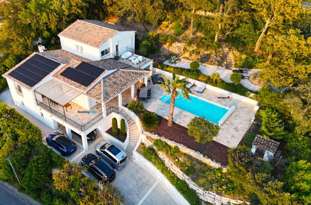 an aerial view of a house with a pool at Les Chenes in Sainte-Maxime