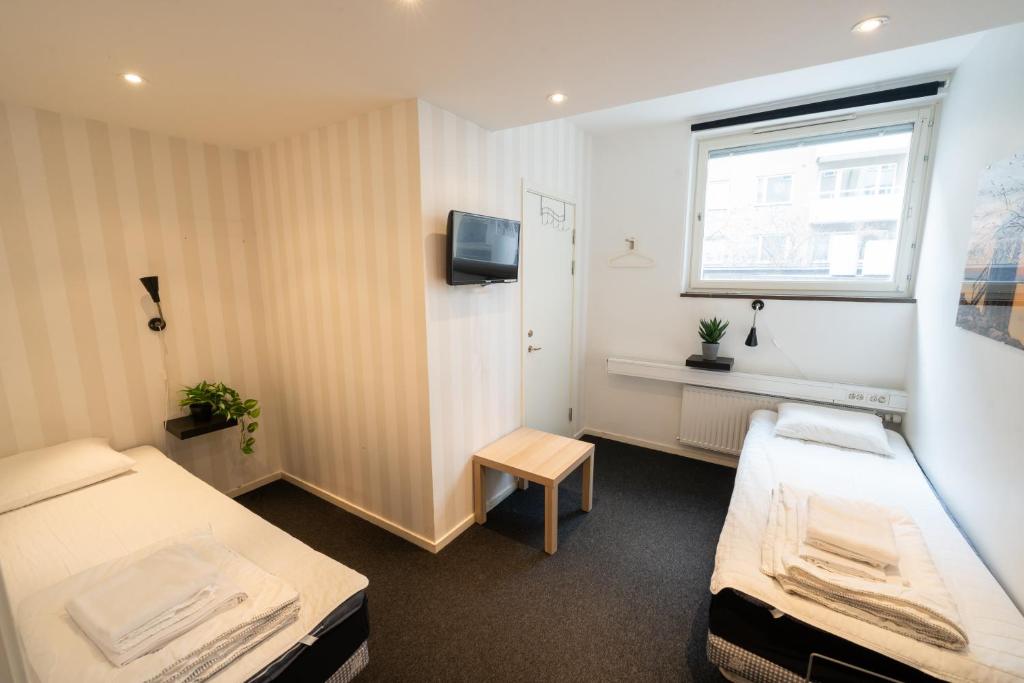 Postel nebo postele na pokoji v ubytování Stockholm Hostel