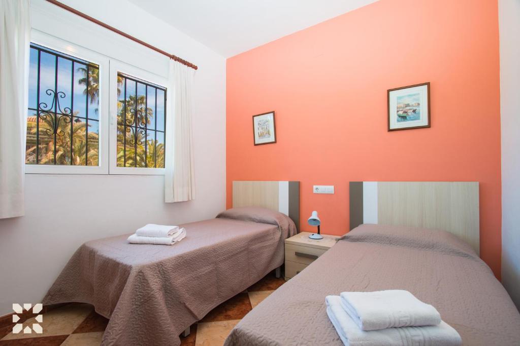 Postel nebo postele na pokoji v ubytování Villa Paula by Abahana Villas