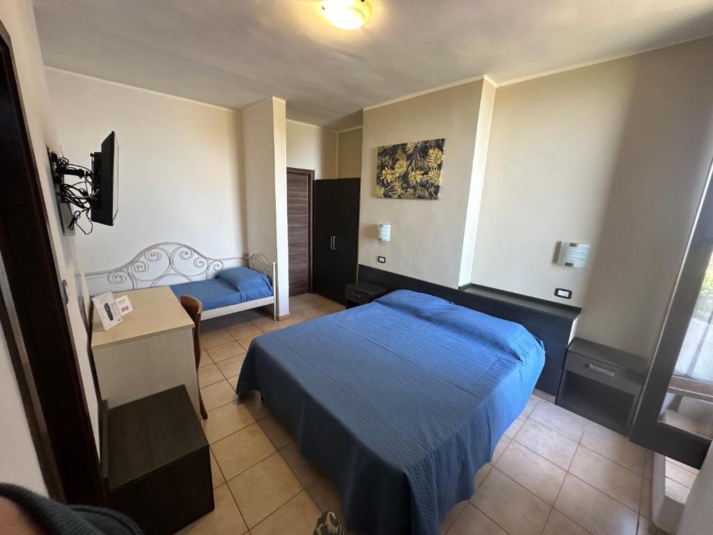 Postel nebo postele na pokoji v ubytování Hotel Normanni