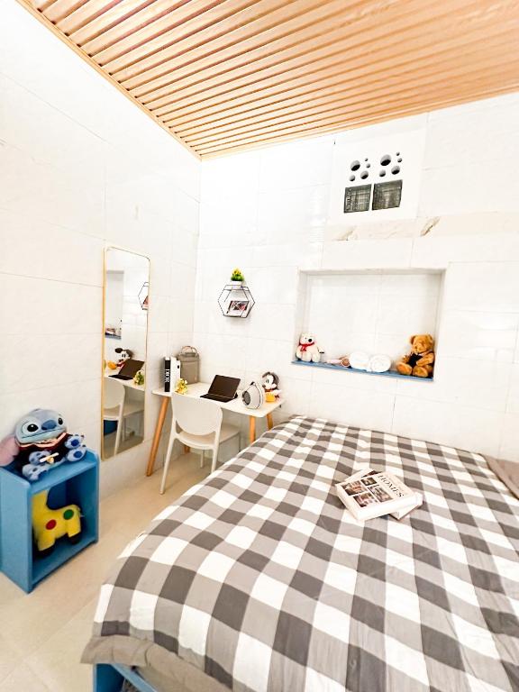 Postel nebo postele na pokoji v ubytování La Casa Di Dicembre Trần Hưng Đạo