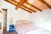 A bed or beds in a room at La Corte del Borgo