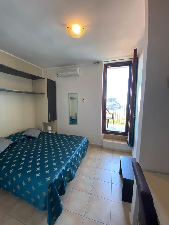 Postel nebo postele na pokoji v ubytování Hotel Normanni