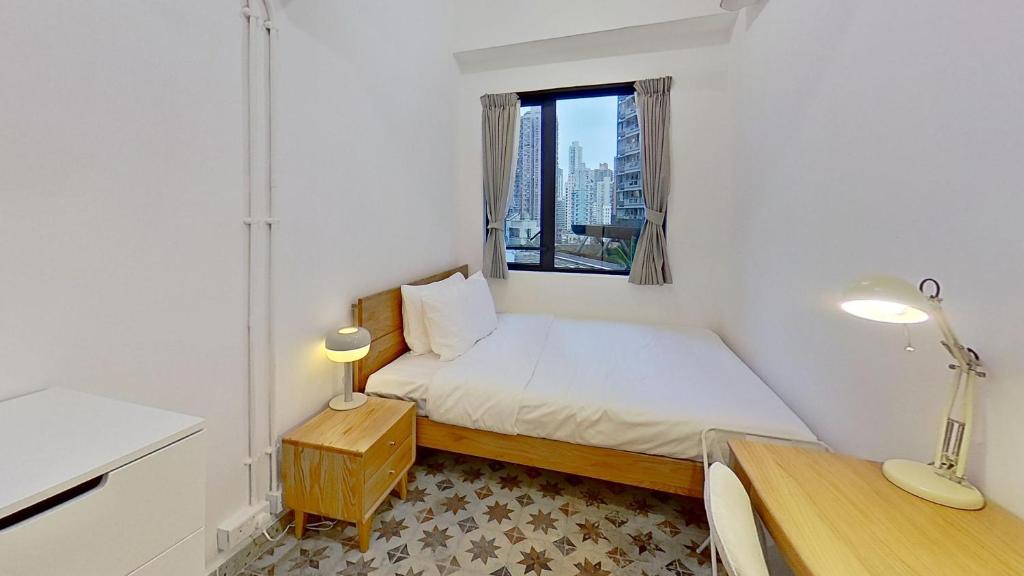 Een bed of bedden in een kamer bij Habyt Bridges - 2 Shing Wong Street