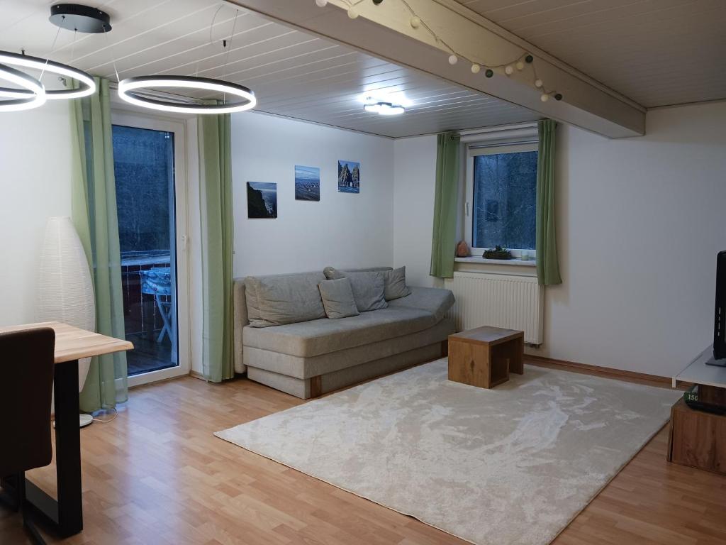 a living room with a couch and a table at Ferienwohnung Waldblick in Freudenstadt