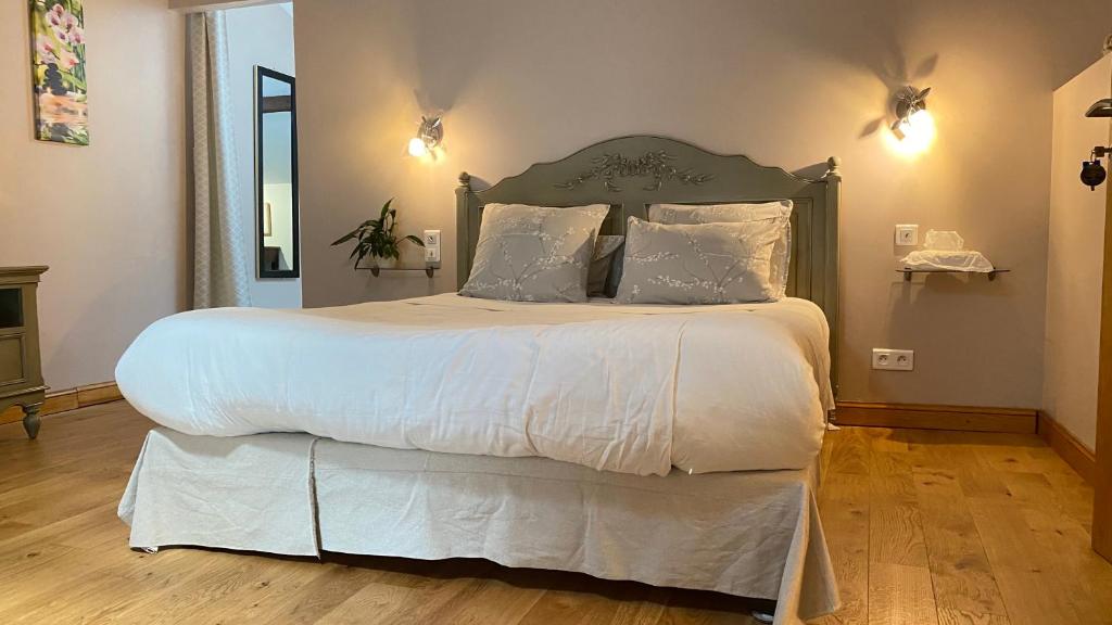 Postel nebo postele na pokoji v ubytování Le Clos du Cèdre