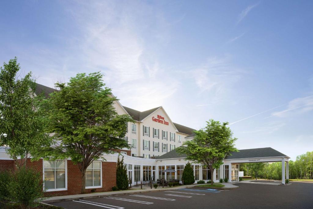 a rendering of the front of a hotel at Hilton Garden Inn Milford in Milford