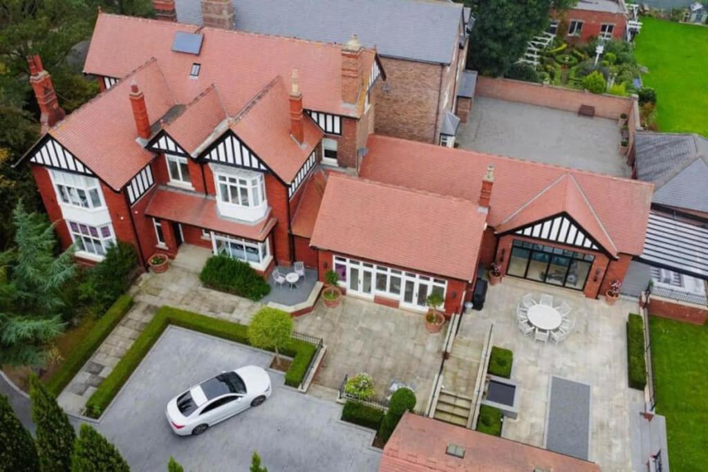 an aerial view of a house with a car parked in front at Guest Homes - The Grove in Hartlepool