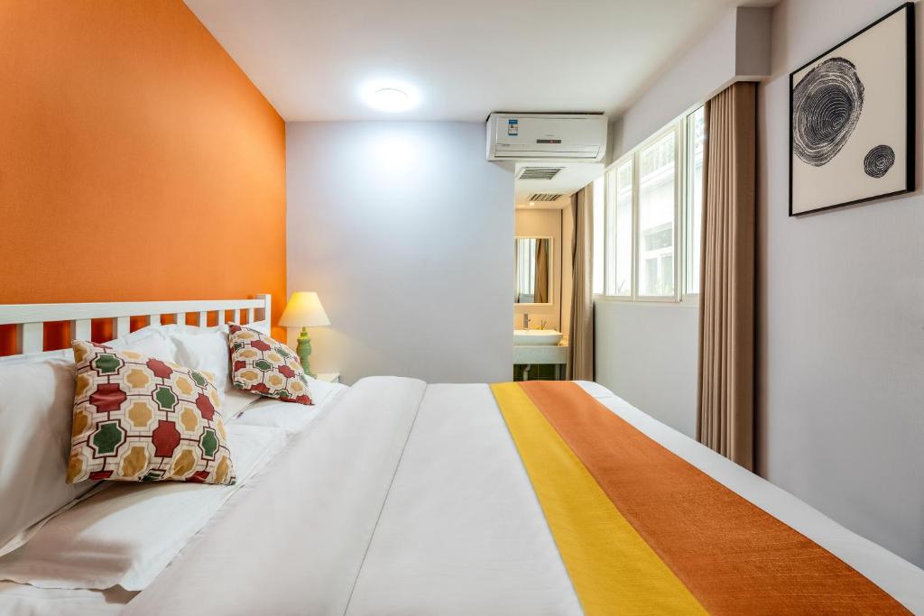 Postel nebo postele na pokoji v ubytování Xi'an See Tang Guesthouse