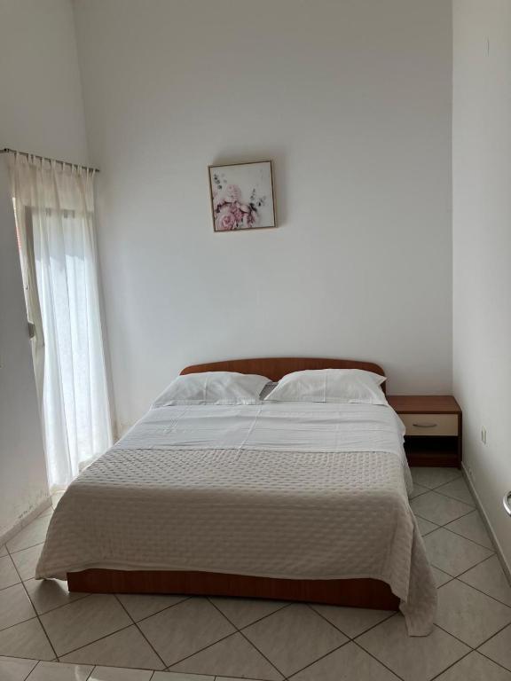 Postel nebo postele na pokoji v ubytování Apartments Nives