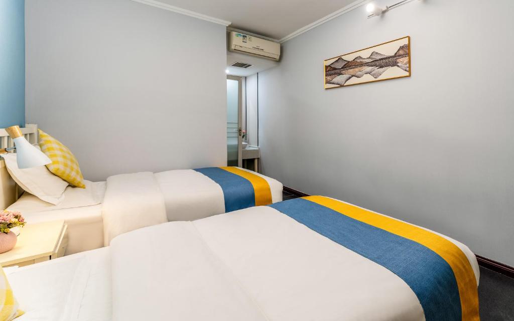 Postel nebo postele na pokoji v ubytování Xi'an See Tang Guesthouse
