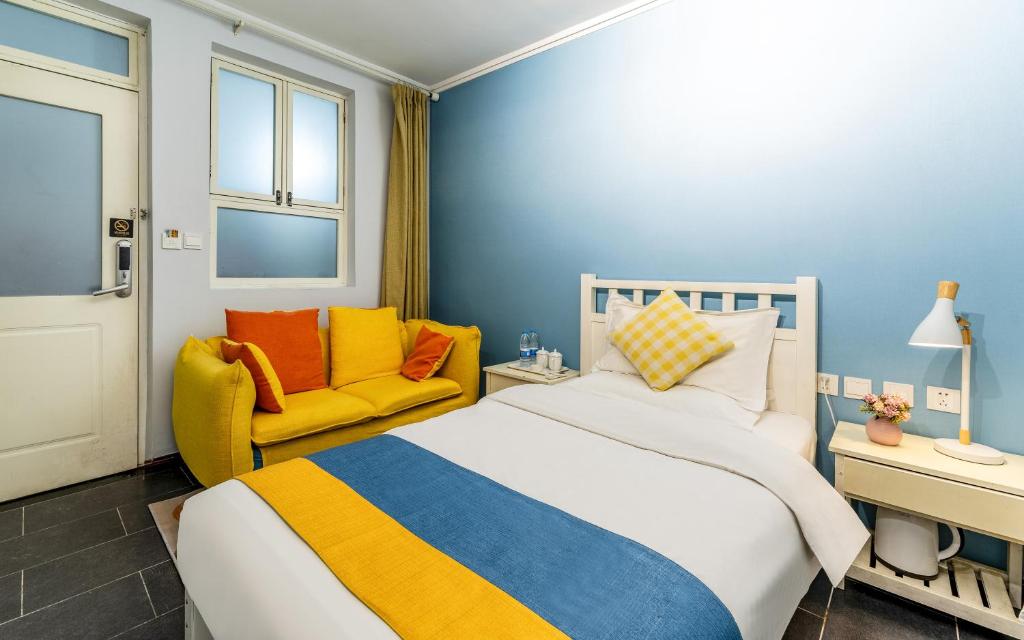 Postel nebo postele na pokoji v ubytování Xi'an See Tang Guesthouse